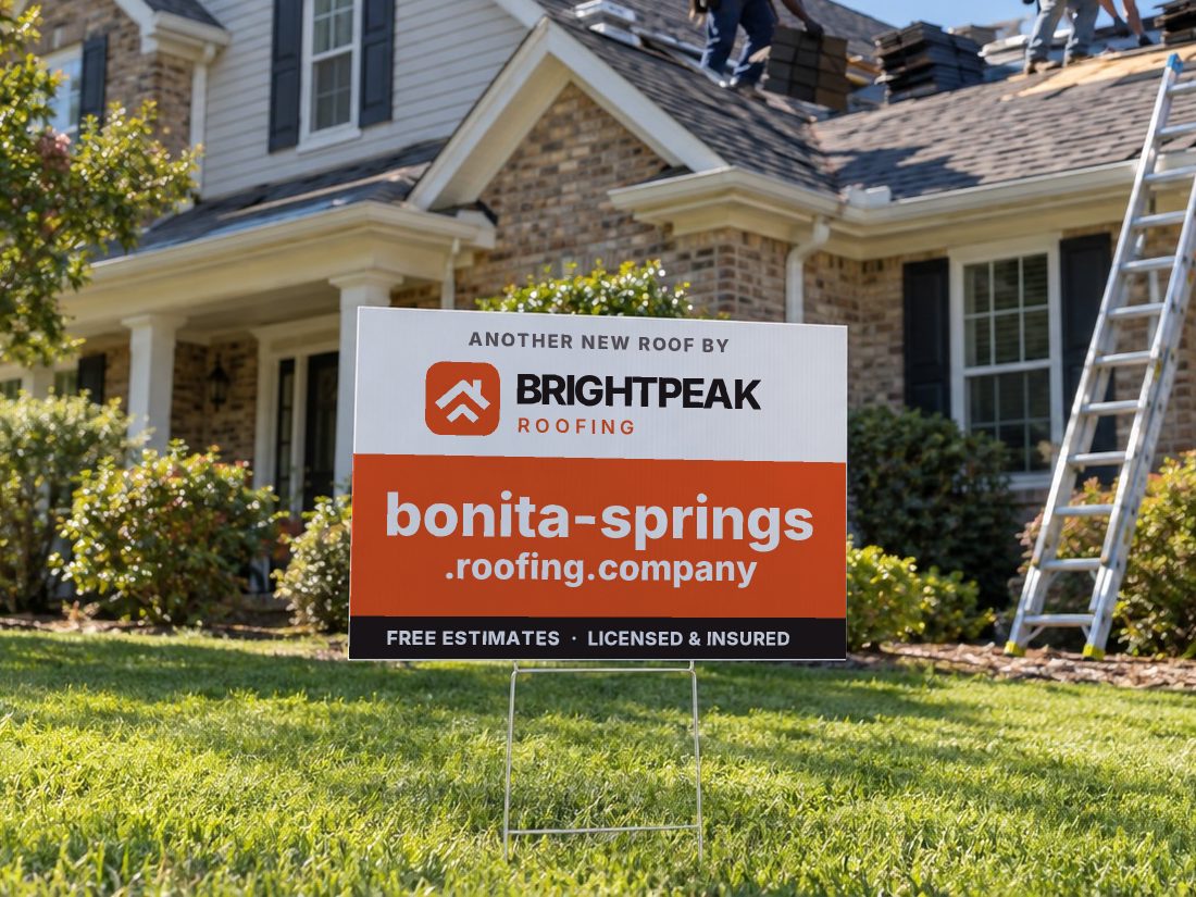 bonita-springs.roofing.company on a yard sign in front of a house getting a new roof
